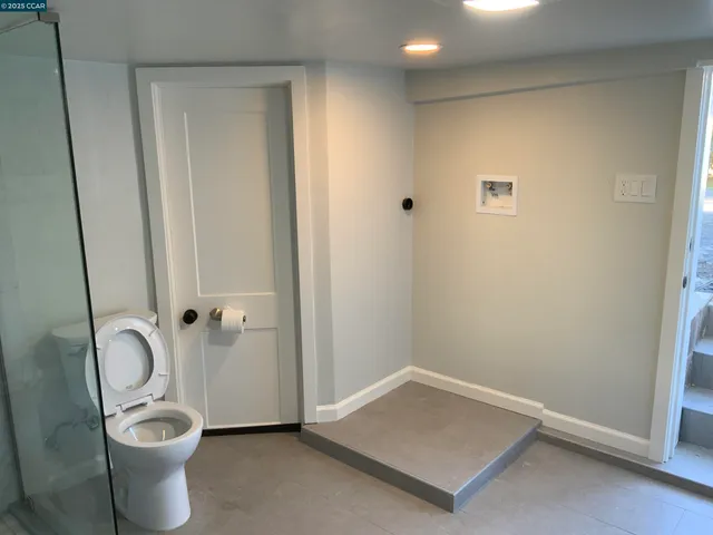 a bathroom with a toilet and a sink