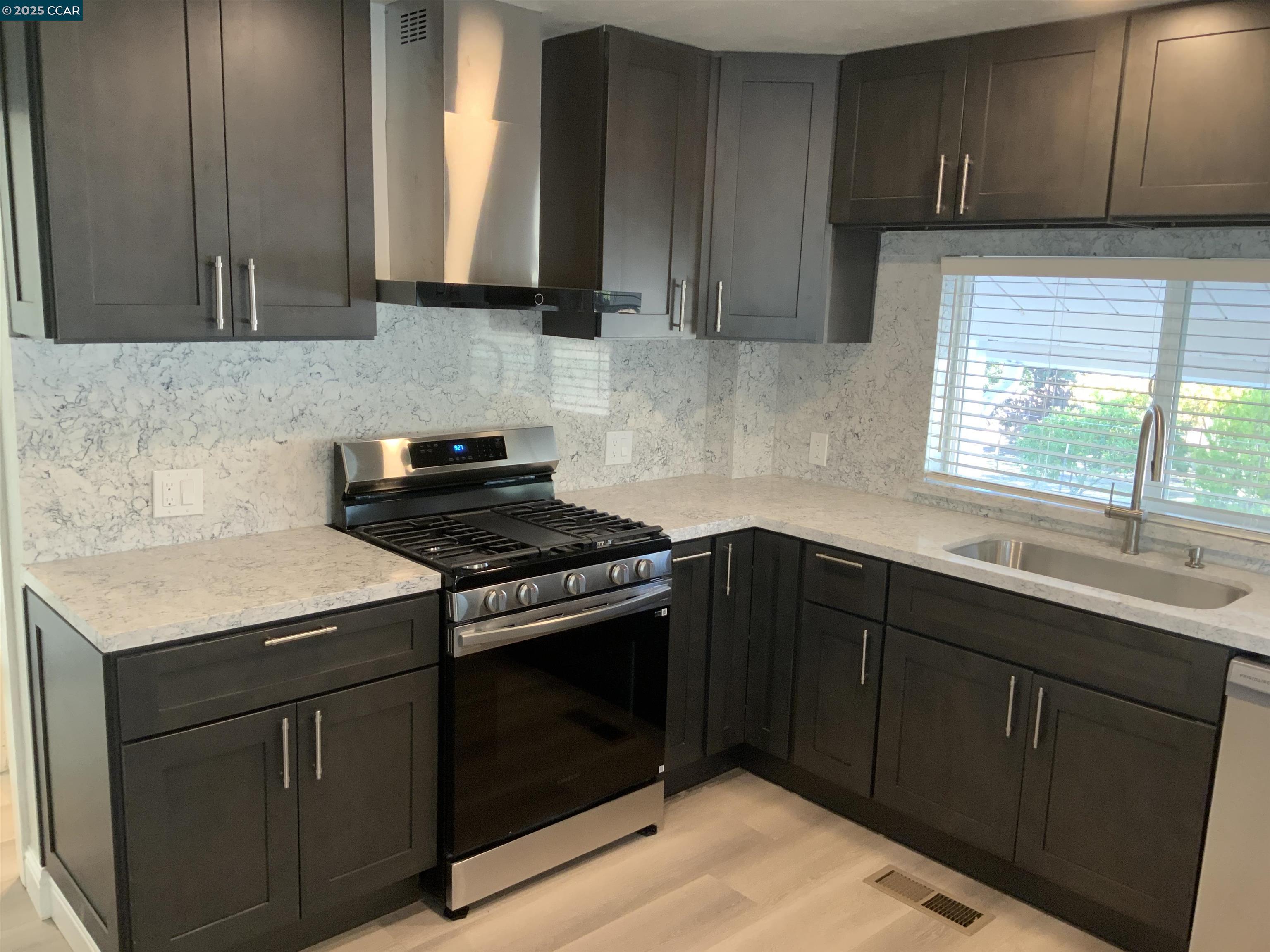 2680 Appian Way Pinole, CA 94564 - Photo 10 of 31 a kitchen with a sink stove and cabinets