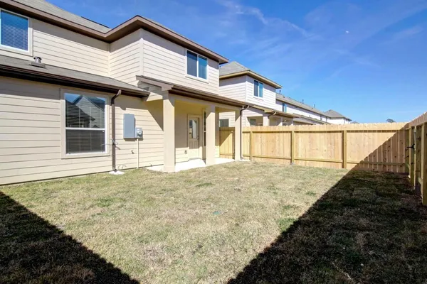 a view of a white house with a large window