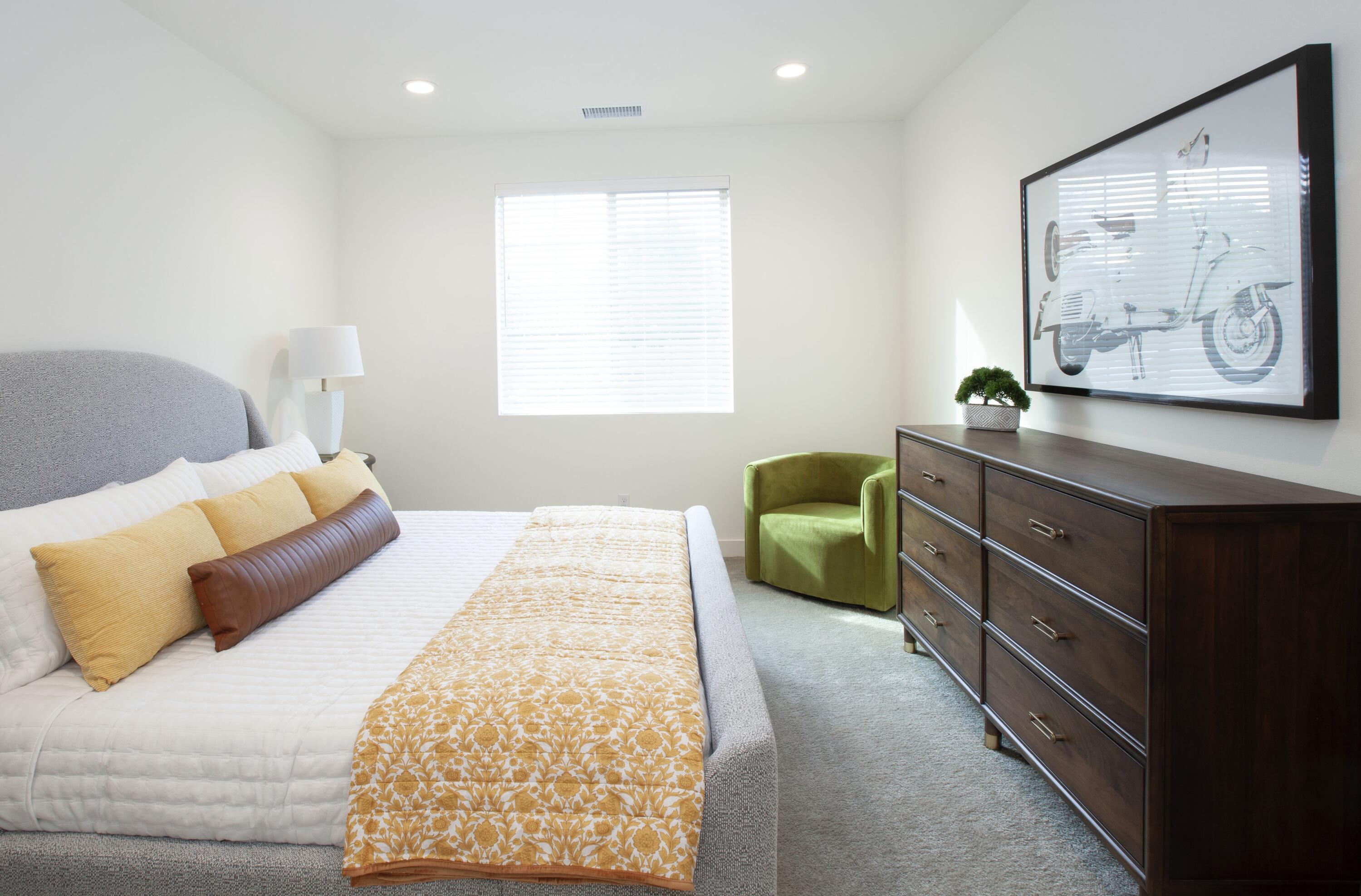 80215 Whisper Rock Way La Quinta, CA 92253 - Photo 13 of 63 a bedroom with a bed and a painting on the wall