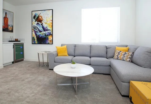 a living room with furniture and a flat screen tv