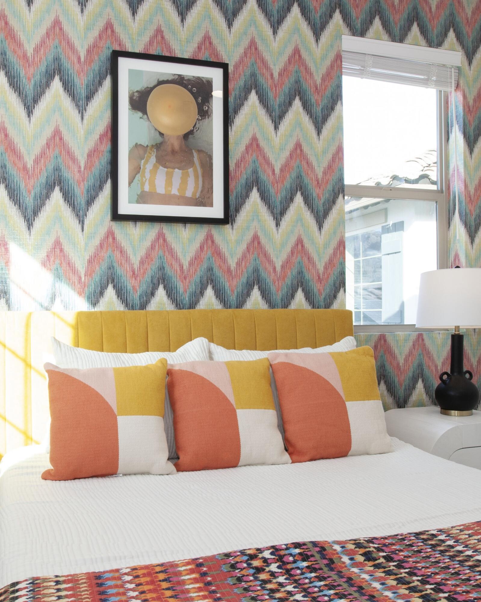 80215 Whisper Rock Way La Quinta, CA 92253 - Photo 28 of 63 a bedroom with a bed and a painting on the wall