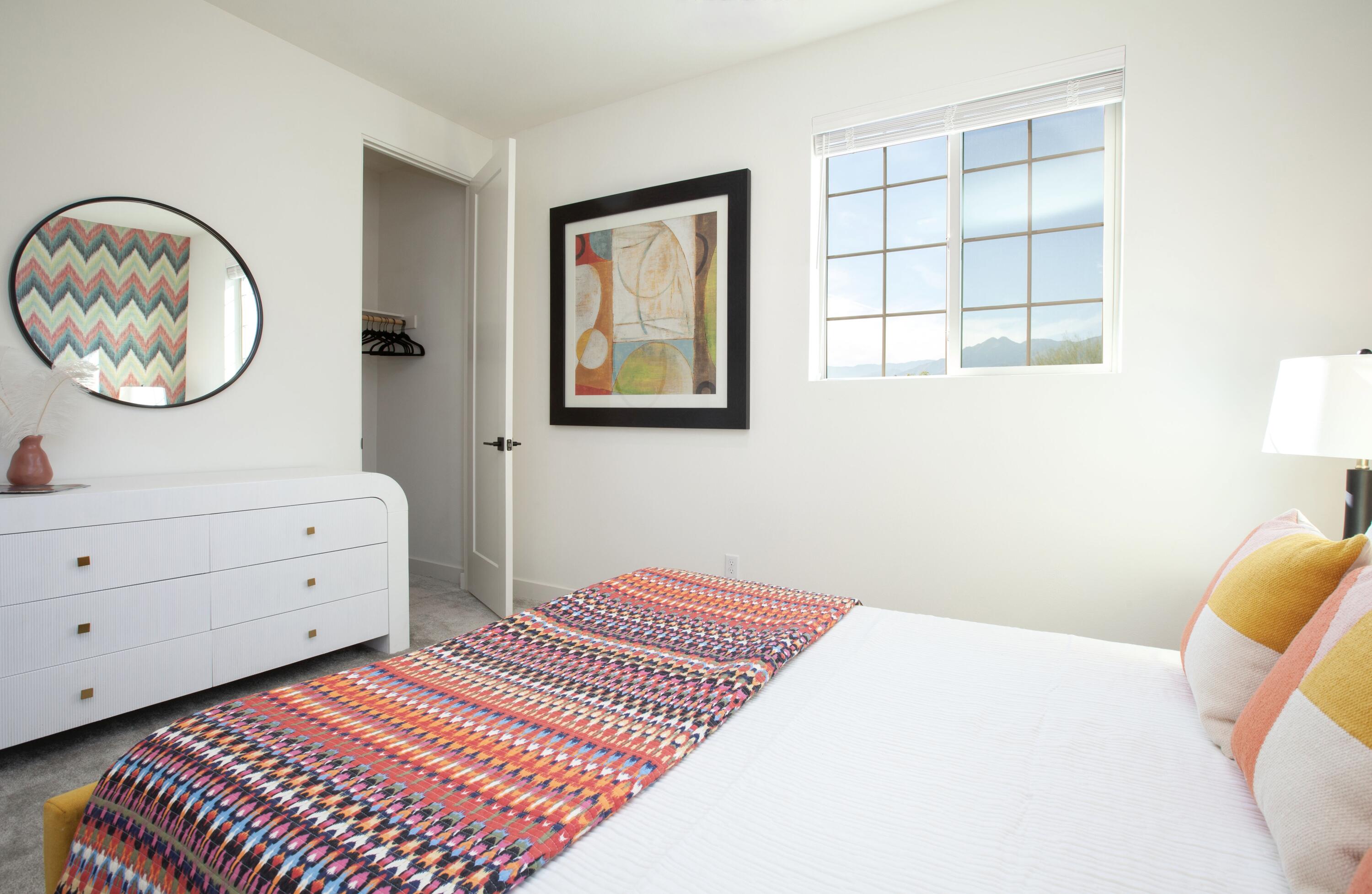 80215 Whisper Rock Way La Quinta, CA 92253 - Photo 29 of 63 a bedroom with a bed and a window