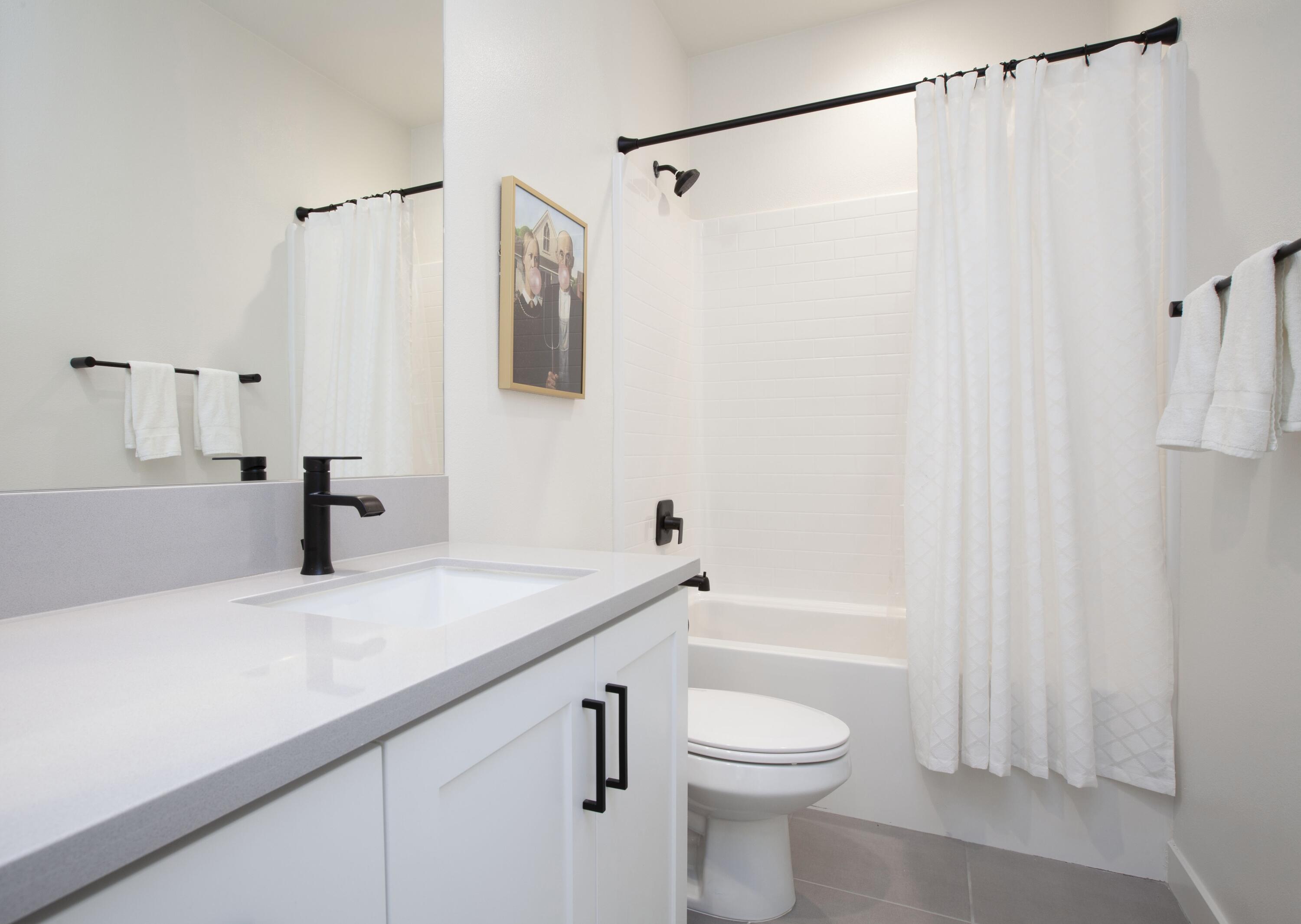 80215 Whisper Rock Way La Quinta, CA 92253 - Photo 32 of 63 a bathroom with a sink a toilet and shower