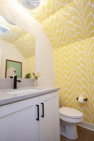 a room with furniture and painting on the wall