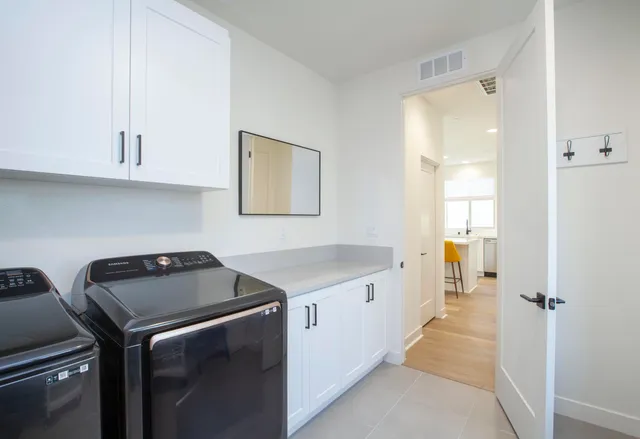a view of swimming pool with outdoor seating and city view
