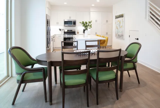 a dining room with furniture and window