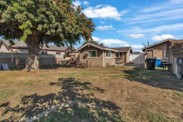 a view of a backyard with large trees