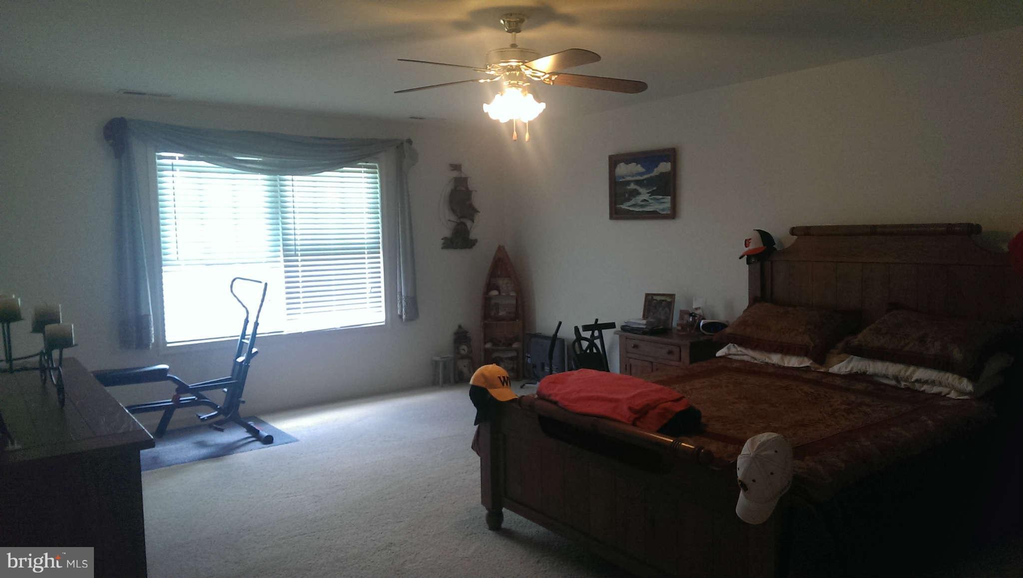 166 Peter Rabbit Drive Ranson, WV 25438 - Photo 3 of 14 a bed room with furniture and a window