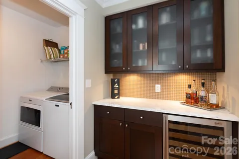 a kitchen with stainless steel appliances granite countertop a sink a stove and cabinets