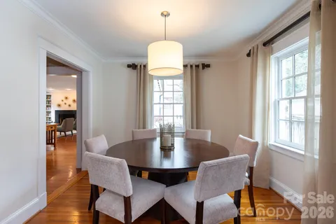 a dining room with furniture window wooden floor