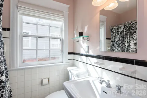 a bathroom with a bathtub and window