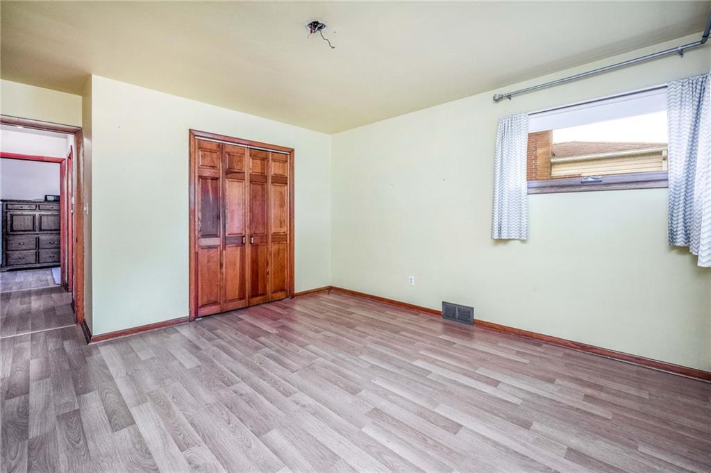 1380 Park Street Sharon, PA 16146 - Photo 15 of 39 a view of an empty room with wooden floor and a window