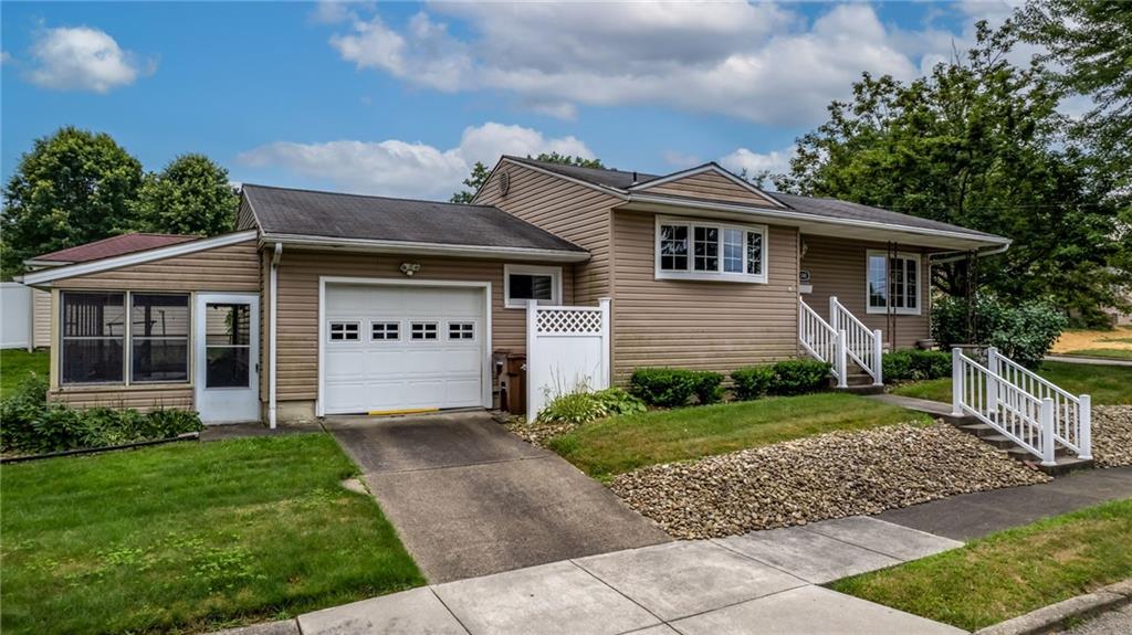 1380 Park Street Sharon, PA 16146 - Photo 29 of 39 a front view of a house with a garden