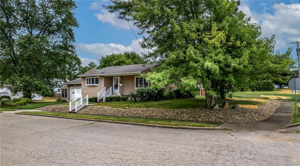 1380 Park Street Sharon, PA 16146 - Photo 36 of 39 a front view of a house with a yard and trees