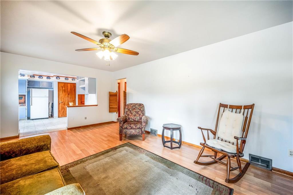 1380 Park Street Sharon, PA 16146 - Photo 7 of 39 a view of a livingroom with furniture and a ceiling fan