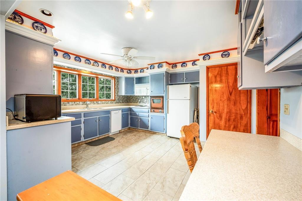 1380 Park Street Sharon, PA 16146 - Photo 10 of 39 a kitchen with stainless steel appliances kitchen island granite countertop a refrigerator and a stove top oven