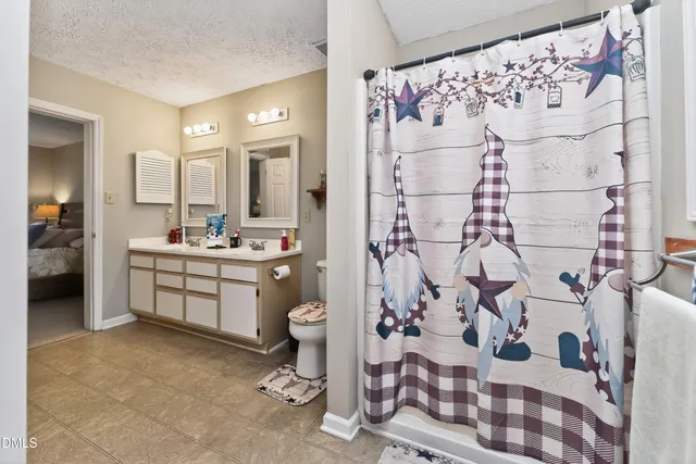 a view of a hallway with closet and a window