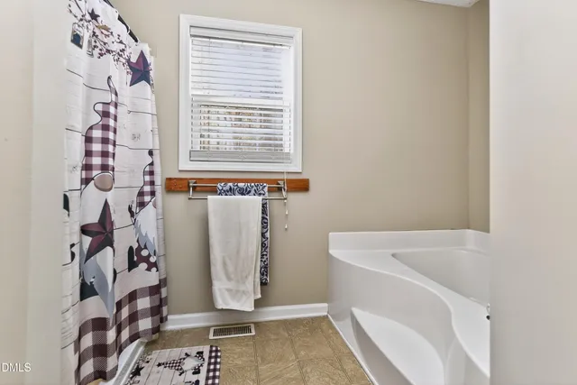 a bedroom with furniture and a bed