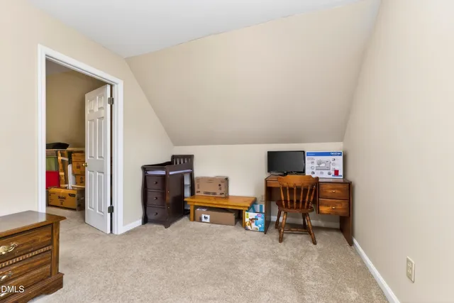 a bathroom with a toilet sink and a mirror