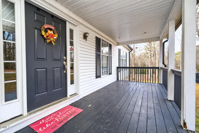 a view of balcony with wooden floor