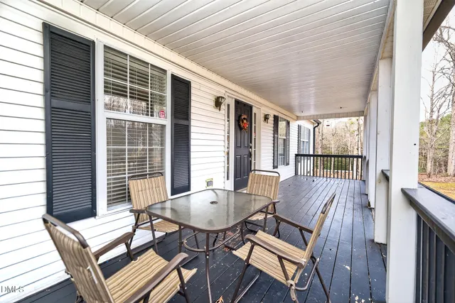 a view of a patio with a table and chairs