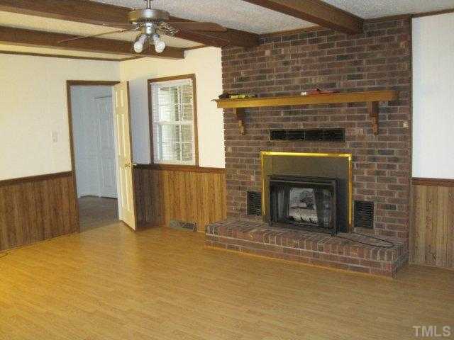 108 Hunters Road Oxford, NC 27565 - Photo 7 of 8 Den with masonary fireplace & gas logs