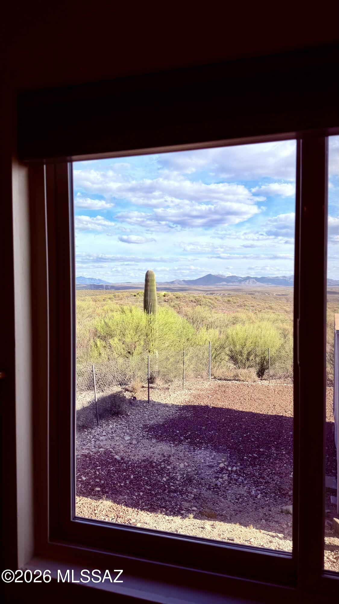 15680 East Colossal Cave Road Vail, AZ 85641 - Photo 18 of 51 Your slice of the desert greets you from the primary bedroom window!