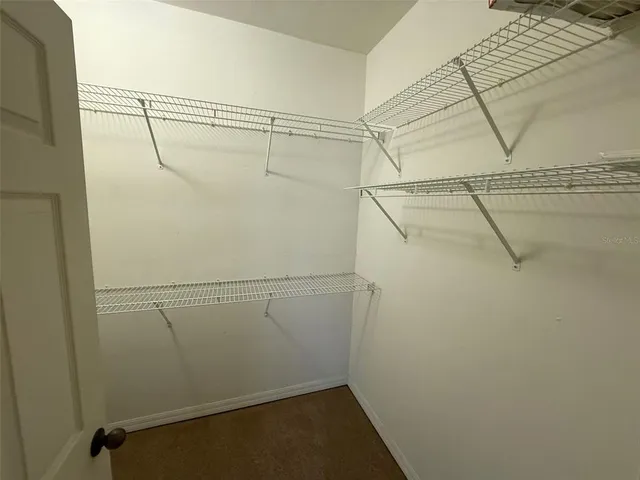 a view of a room with racks on the wall