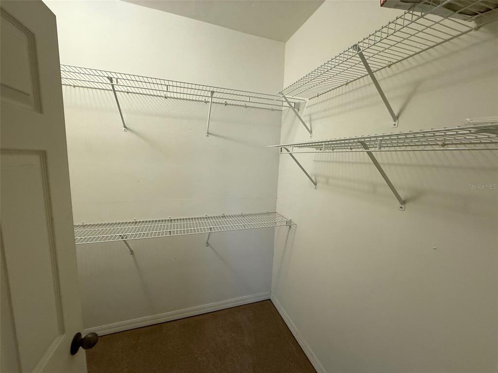 13200 West Newberry Road, Unit 29 Newberry, FL 32669 - Photo 11 of 14 a view of a room with racks on the wall