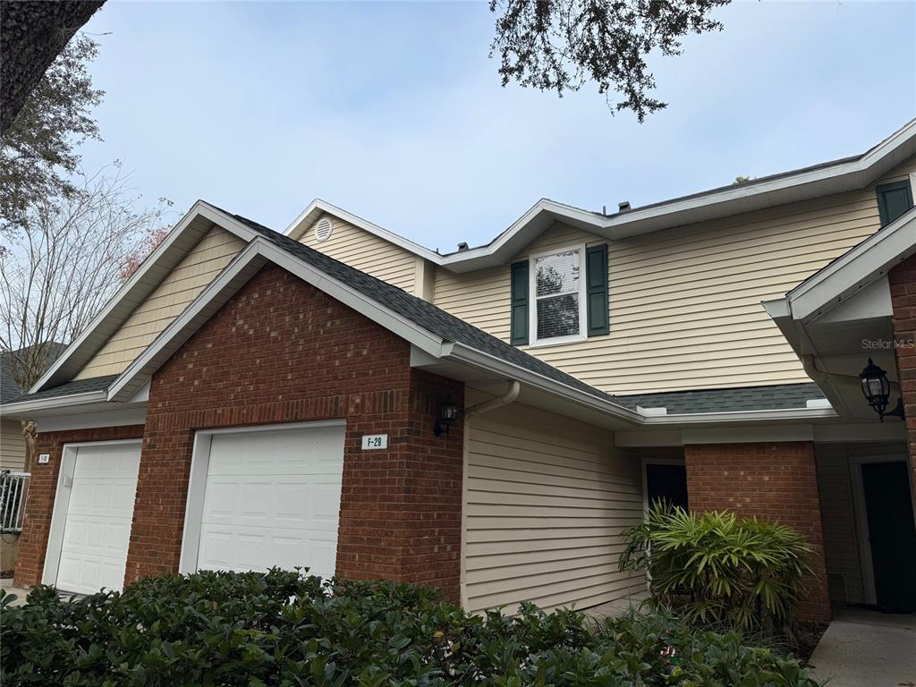 13200 West Newberry Road, Unit 29 Newberry, FL 32669 - Photo 14 of 14 a front view of a house with a garden