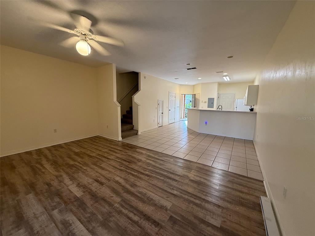 13200 West Newberry Road, Unit 29 Newberry, FL 32669 - Photo 2 of 14 a view of kitchen and hall with wooden floor