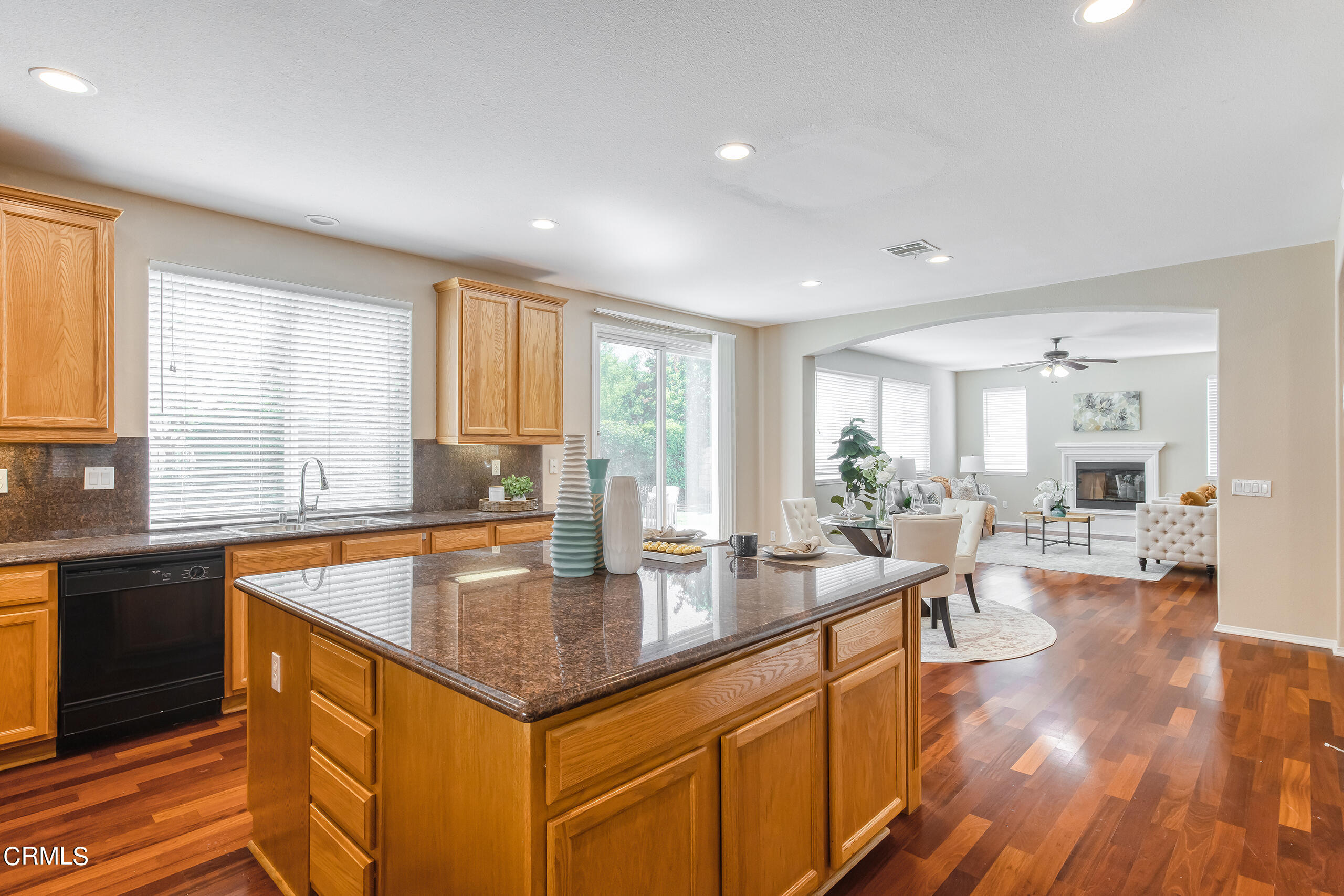 26569 Shakespeare Lane Stevenson Ranch, CA 91381 - Photo 20 of 55 a large kitchen with kitchen island a large island in it