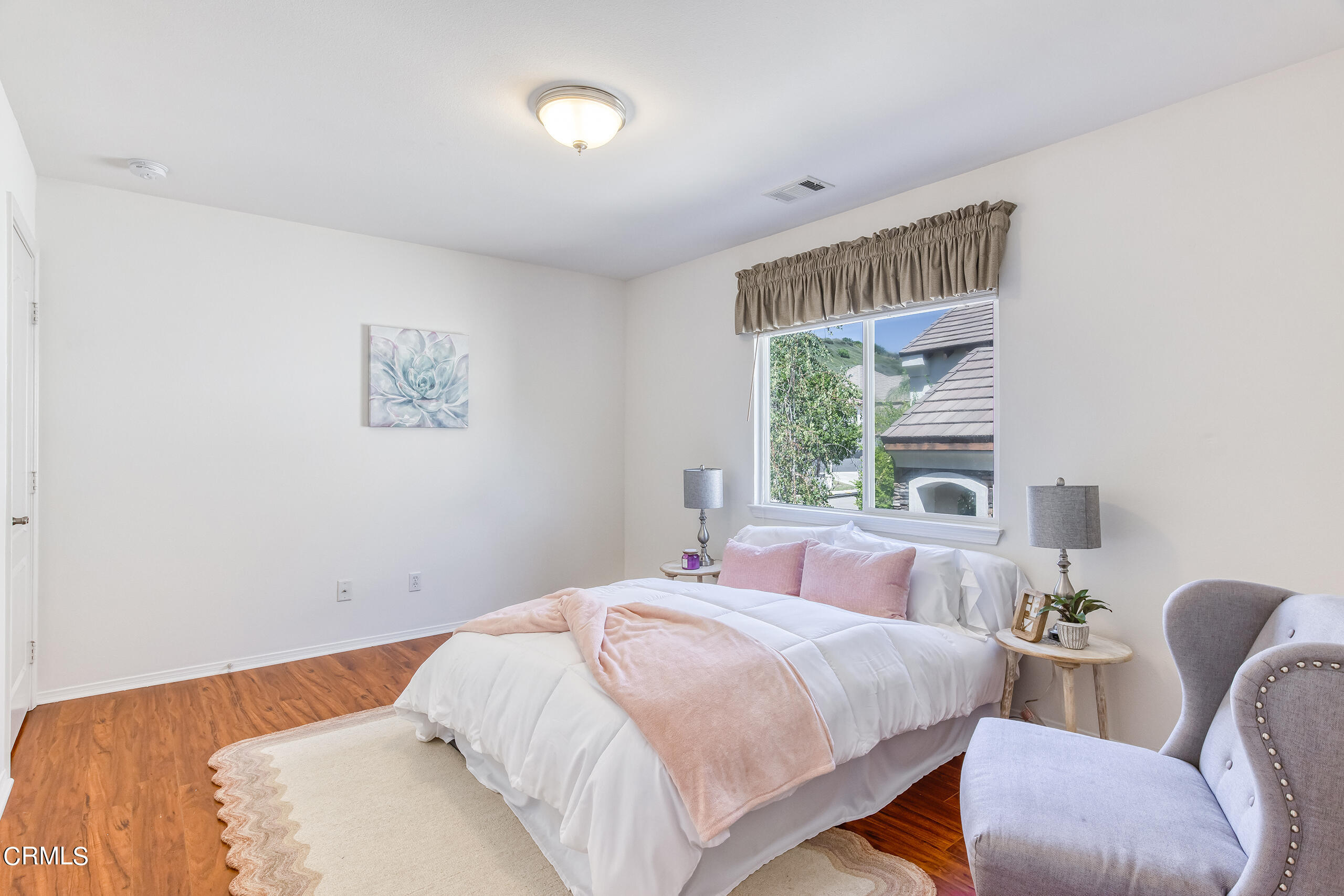 26569 Shakespeare Lane Stevenson Ranch, CA 91381 - Photo 35 of 55 a bedroom with bed and a window