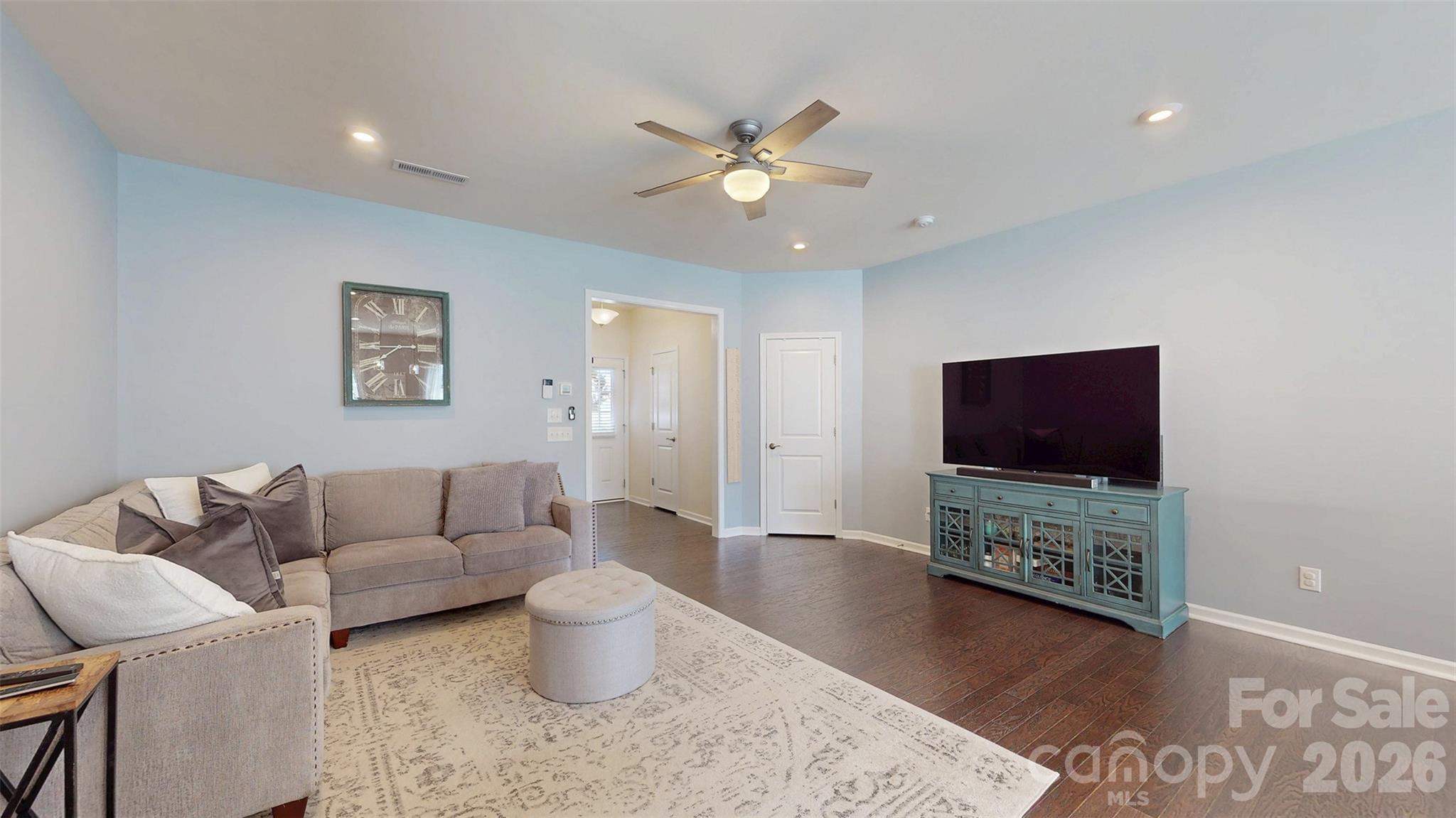 827 Canoe Song Road Fort Mill, SC 29708 - Photo 4 of 33 a living room with furniture and a flat screen tv
