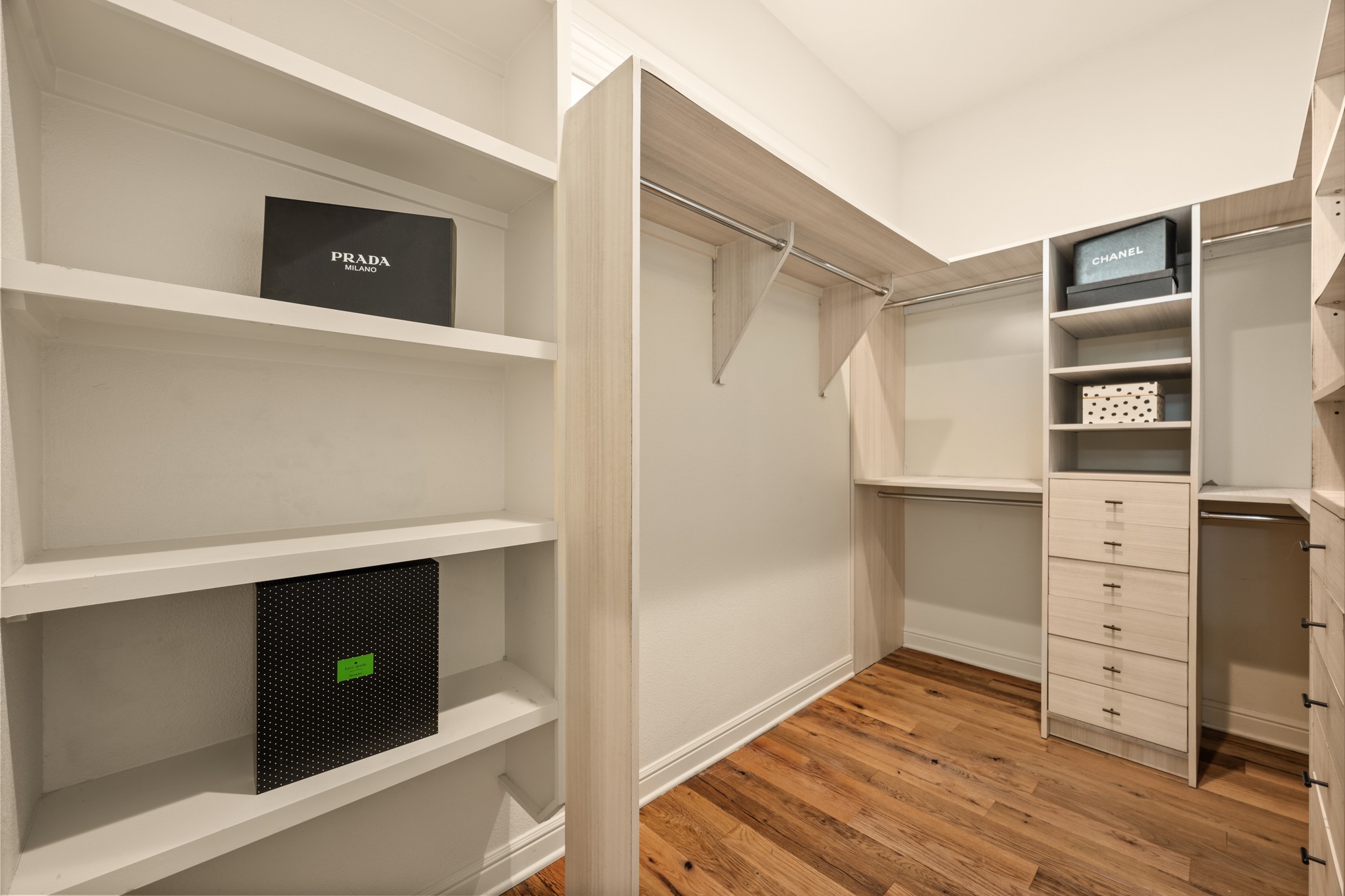 3907 Bailey Lane Austin, TX 78756 - Photo 20 of 40 Experience true organizational luxury in this expansive walk-in closet, featuring custom built-ins and ample storage space designed to accommodate even the most extensive wardrobe with ease