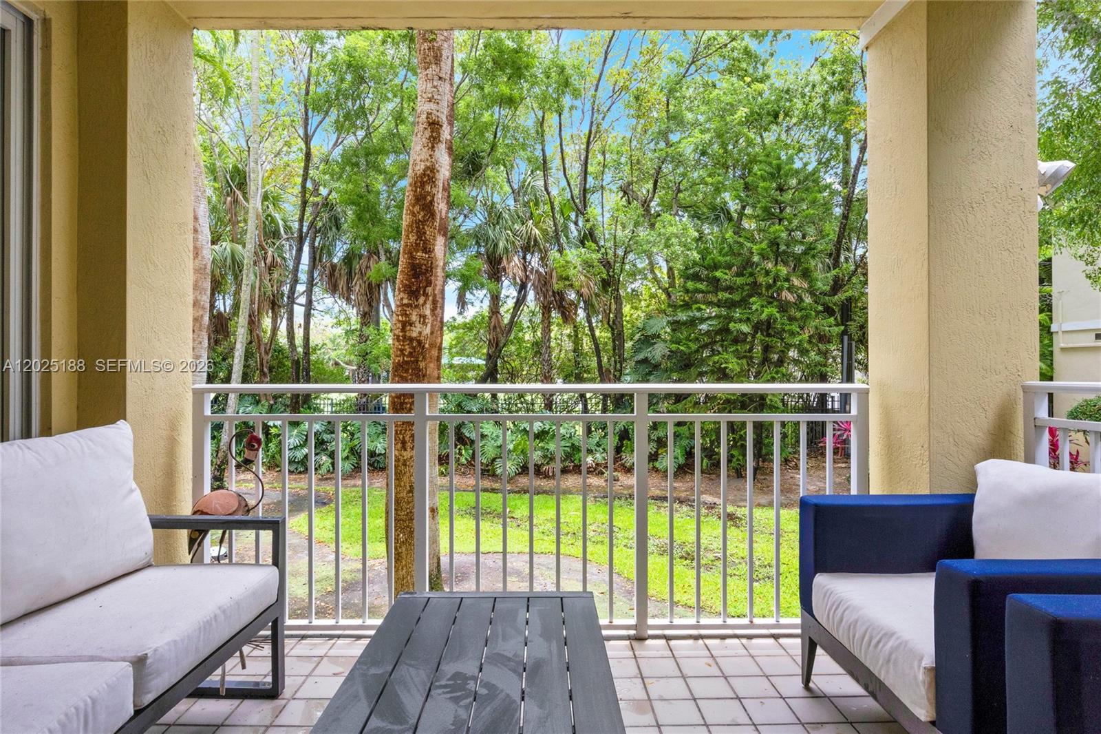 7620 Southwest 102nd Street, Unit 121 Pinecrest, FL 33156 - Photo 8 of 18 a view of a two chairs in the balcony