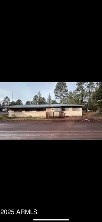 a view of a living room and kitchen
