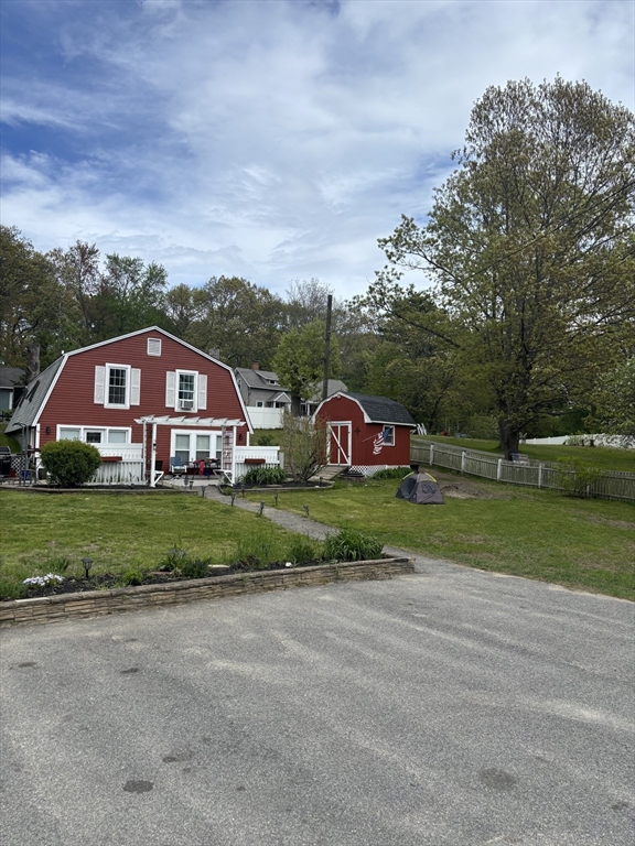 a view of house with outdoor space and street view