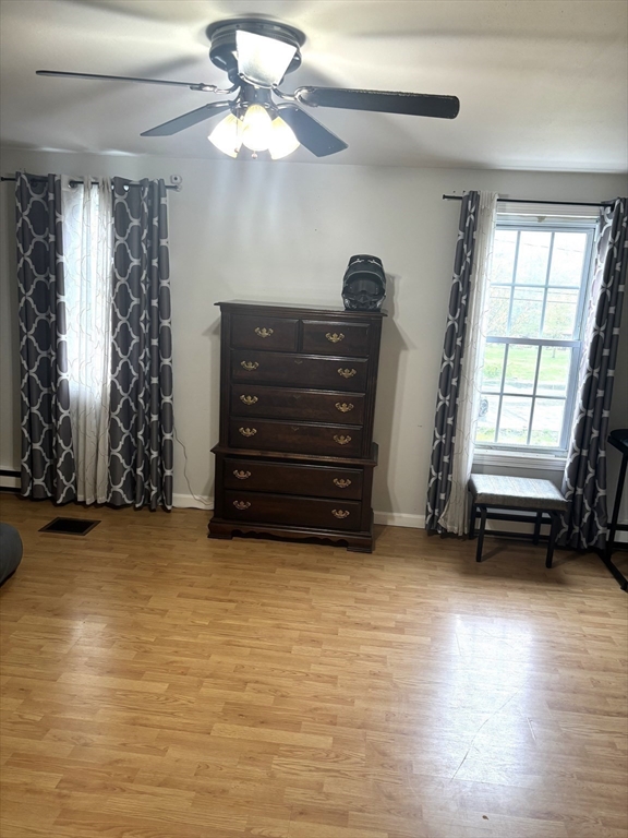 13 Dock Lane Salisbury, MA 01952 - Photo 11 of 23 an empty room with windows and ceiling fan
