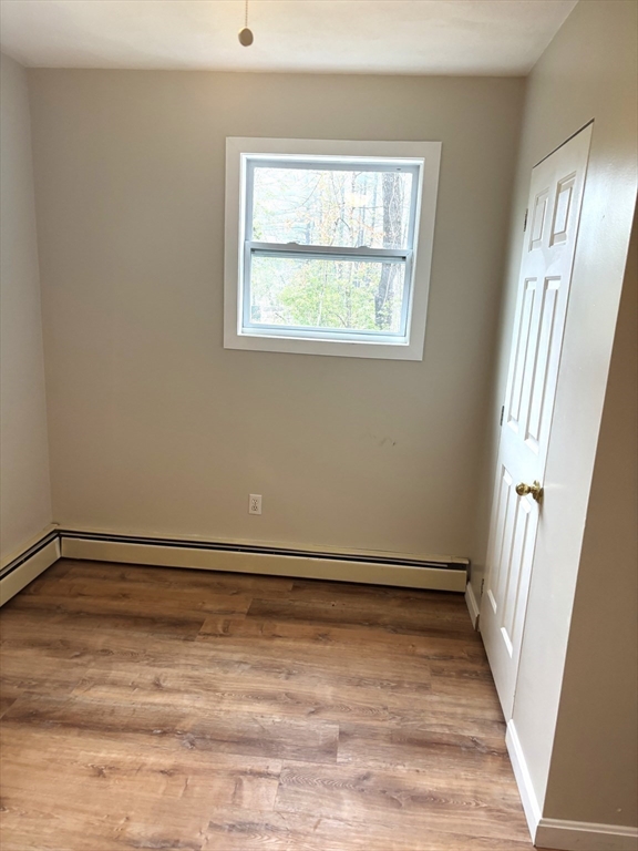 13 Dock Lane Salisbury, MA 01952 - Photo 19 of 23 a view of an empty room with wooden floor and a window