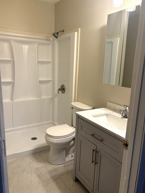 13 Dock Lane Salisbury, MA 01952 - Photo 20 of 23 a bathroom with a sink a toilet and shower