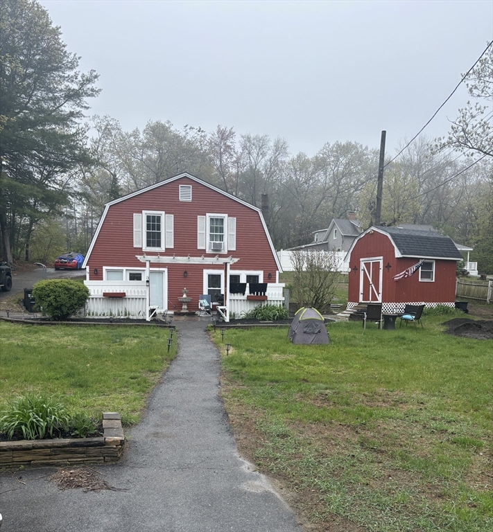 13 Dock Lane Salisbury, MA 01952 - Photo 2 of 23 a front view of a house with garden