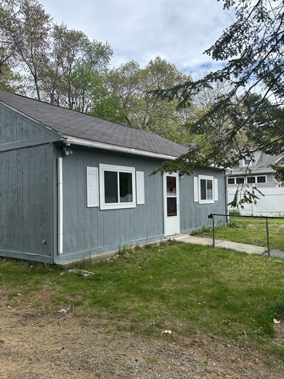 13 Dock Lane Salisbury, MA 01952 - Photo 22 of 23 a house that has a tree in front of it