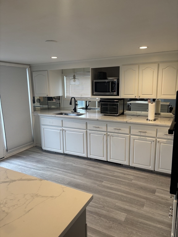 13 Dock Lane Salisbury, MA 01952 - Photo 4 of 23 a kitchen with stainless steel appliances granite countertop a sink and cabinets