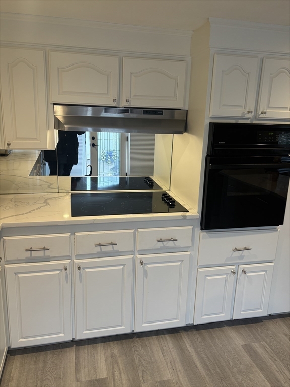13 Dock Lane Salisbury, MA 01952 - Photo 5 of 23 a kitchen with white cabinets and appliances