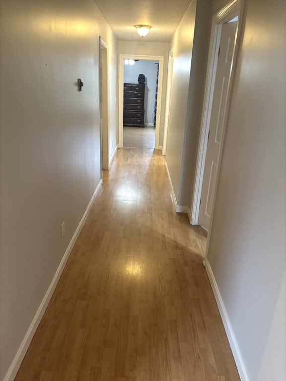 13 Dock Lane Salisbury, MA 01952 - Photo 10 of 23 a view of a hallway with wooden floor