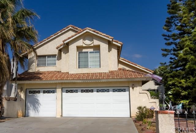 8764 Feathertop Road Riverside, CA 92508 - Photo 1 of 1 a front view of a house with a yard