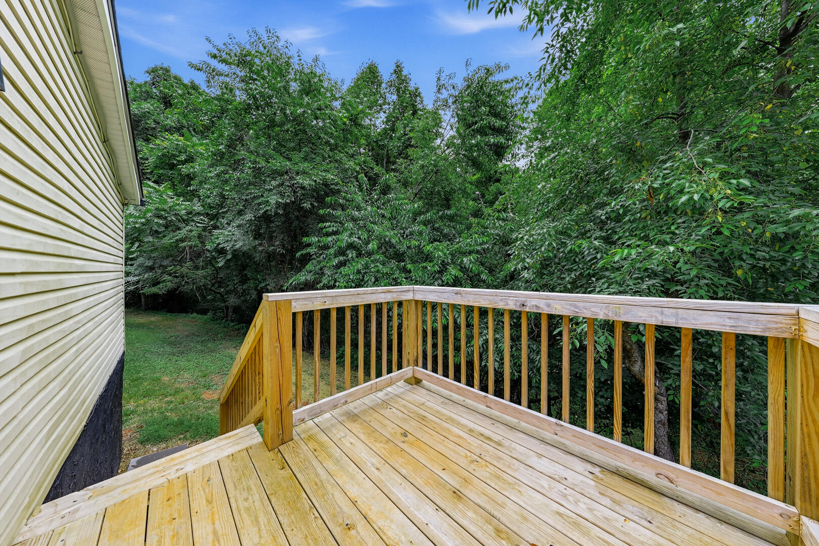 304 Ridgelake Road Goodview, VA 24095 - Photo 26 of 34 a view of balcony with wooden floor and fence