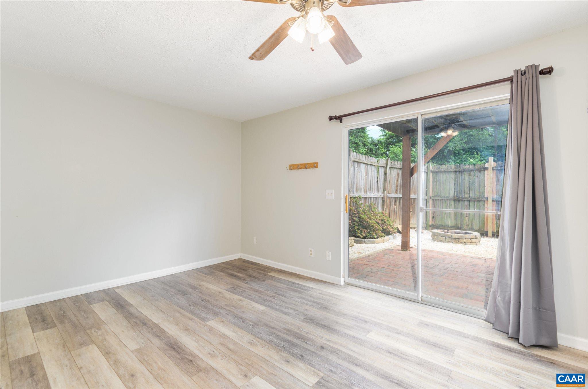 1548 Cool Spring Road Charlottesville, VA 22901 - Photo 6 of 37 a view of a big room with wooden floor and windows